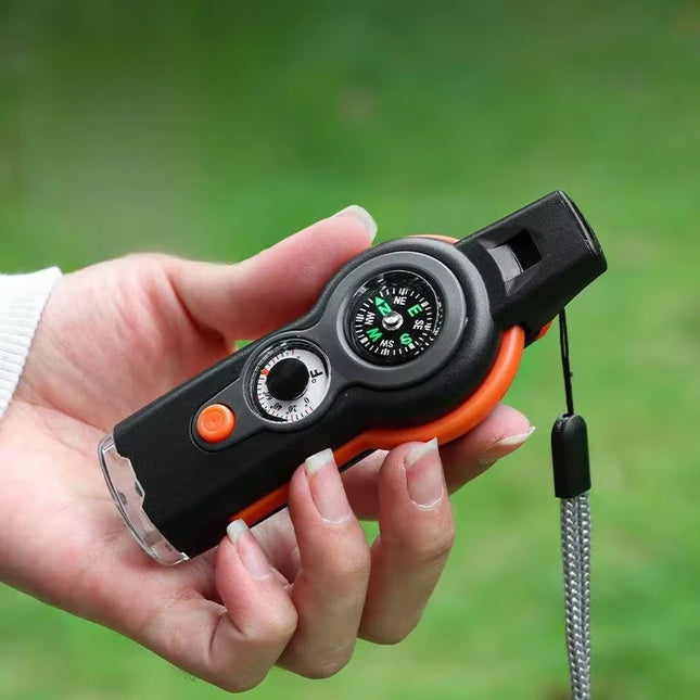 7-in-1 Survival Whistle – LED, Compass, Thermometer for Camping!